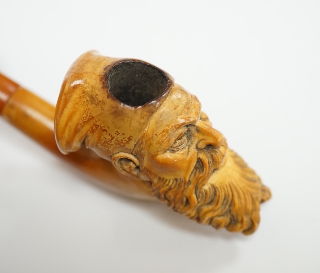 A small group of collectables including a cased Meerschaum pipe, a Dunhill lighter, a yellow metal mounted nephrite pendant, 53mm, yellow metal mounted amber cigarette holder in a silver case, Eloga wrist watch, etc. Con